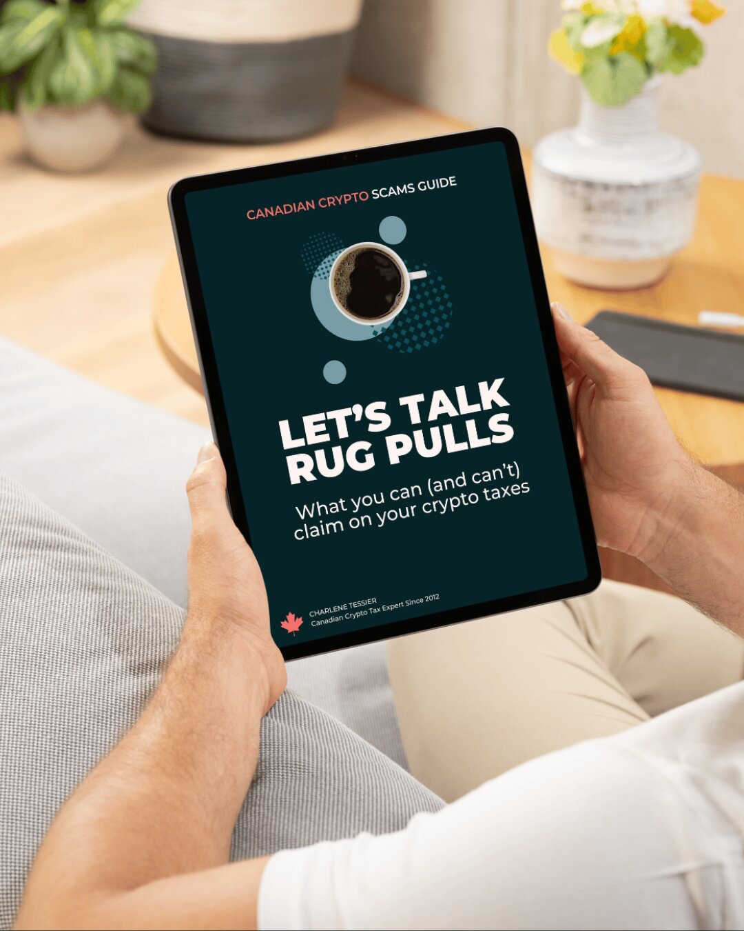 The Let's Talk Rug Pulls guide on a tablet, held in someone's hands